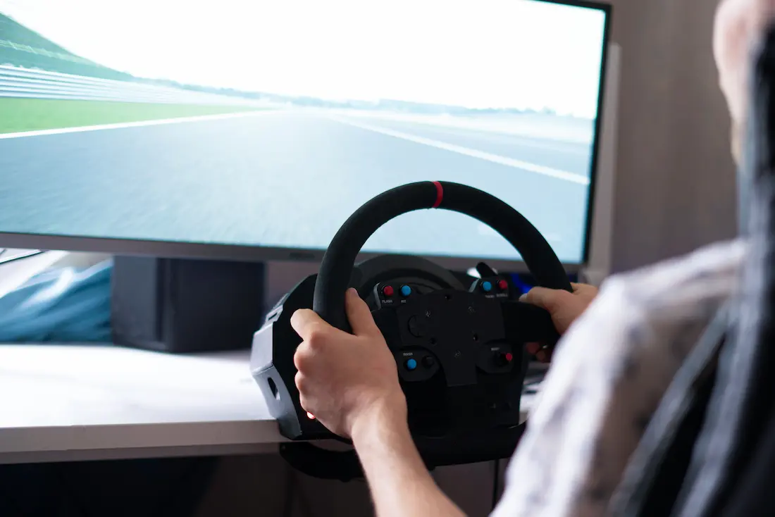 person using driving simulator